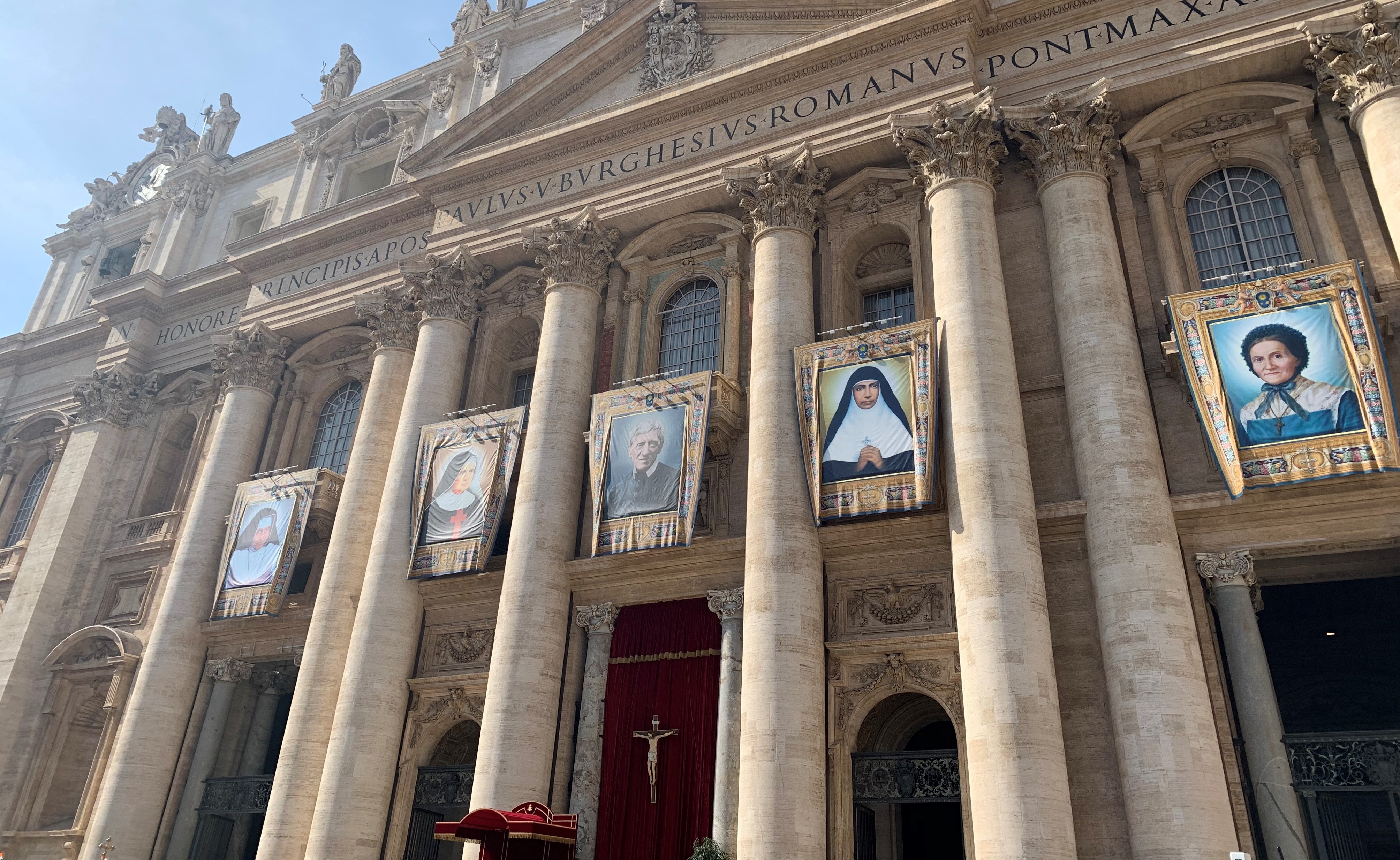 A picture of Cardinal Newman hangs outside St Peter's Basilica in Rome.