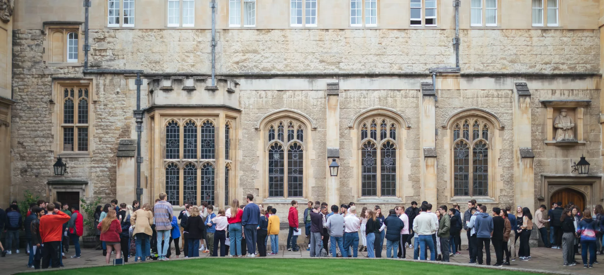 A group of students outside the Trinity Dining hall shot from across the quad.