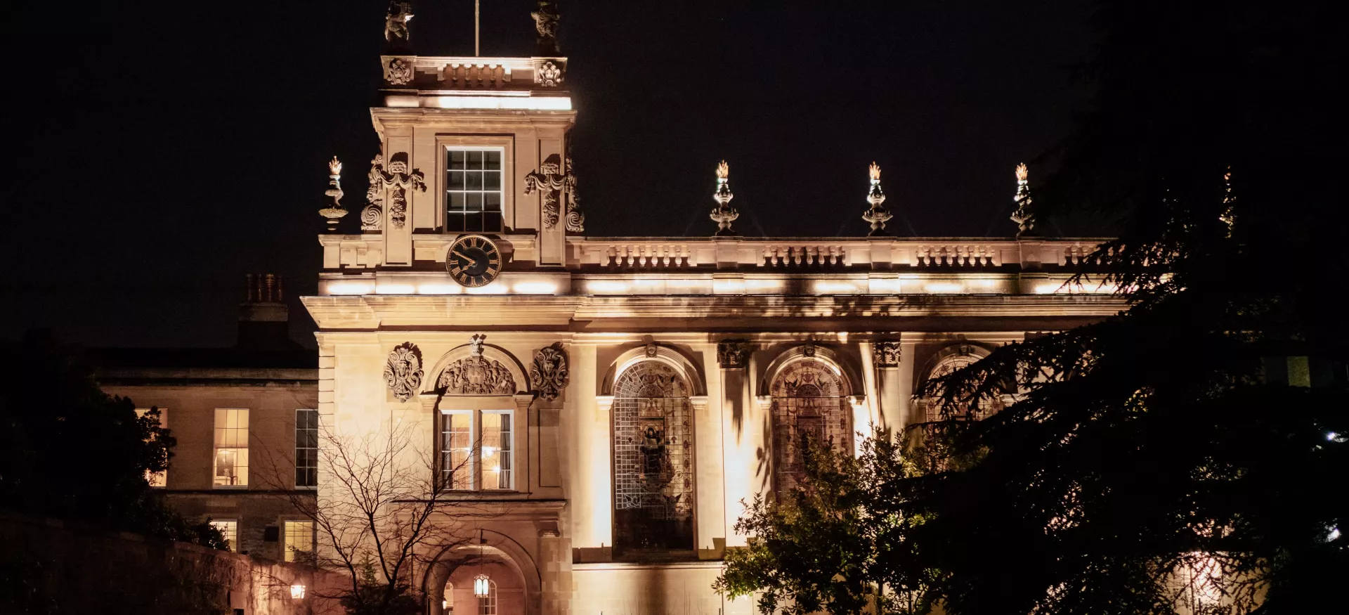 The Trinity Chapel tower lit up at night.