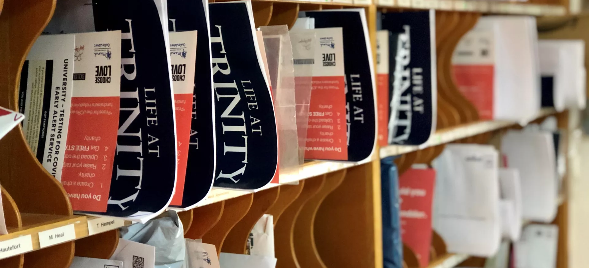 A close-up view of pigeonholes in the Trinity College lodge, with post sticking out.