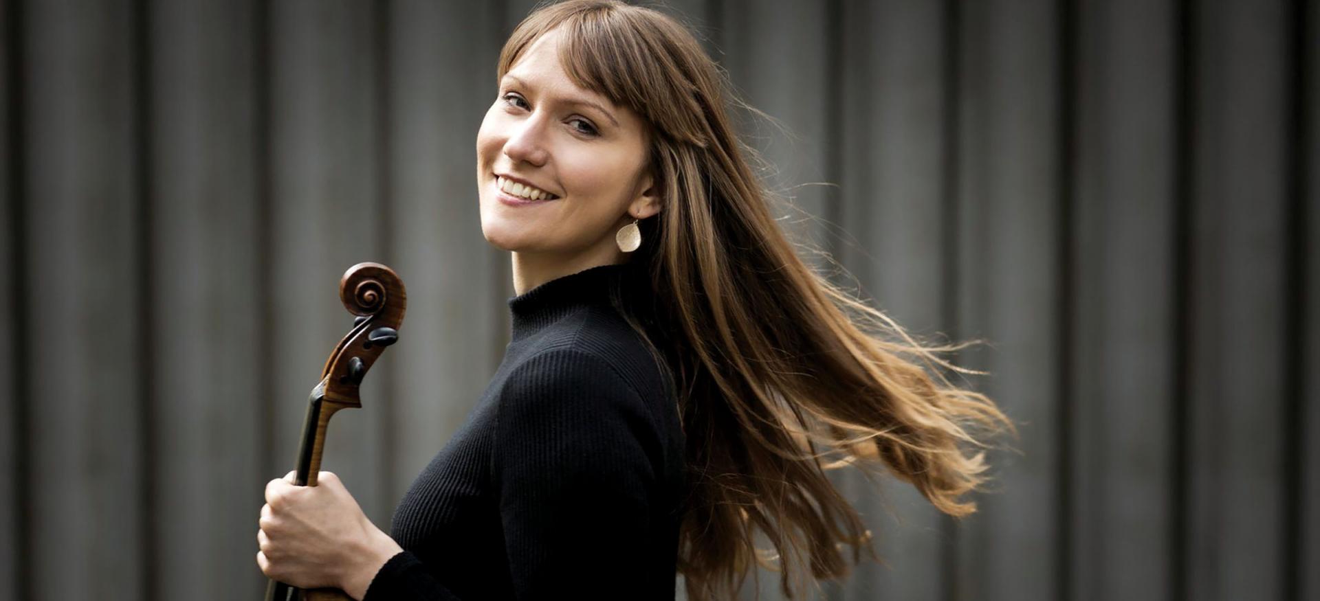 Rosalind Ventris holds her viola 