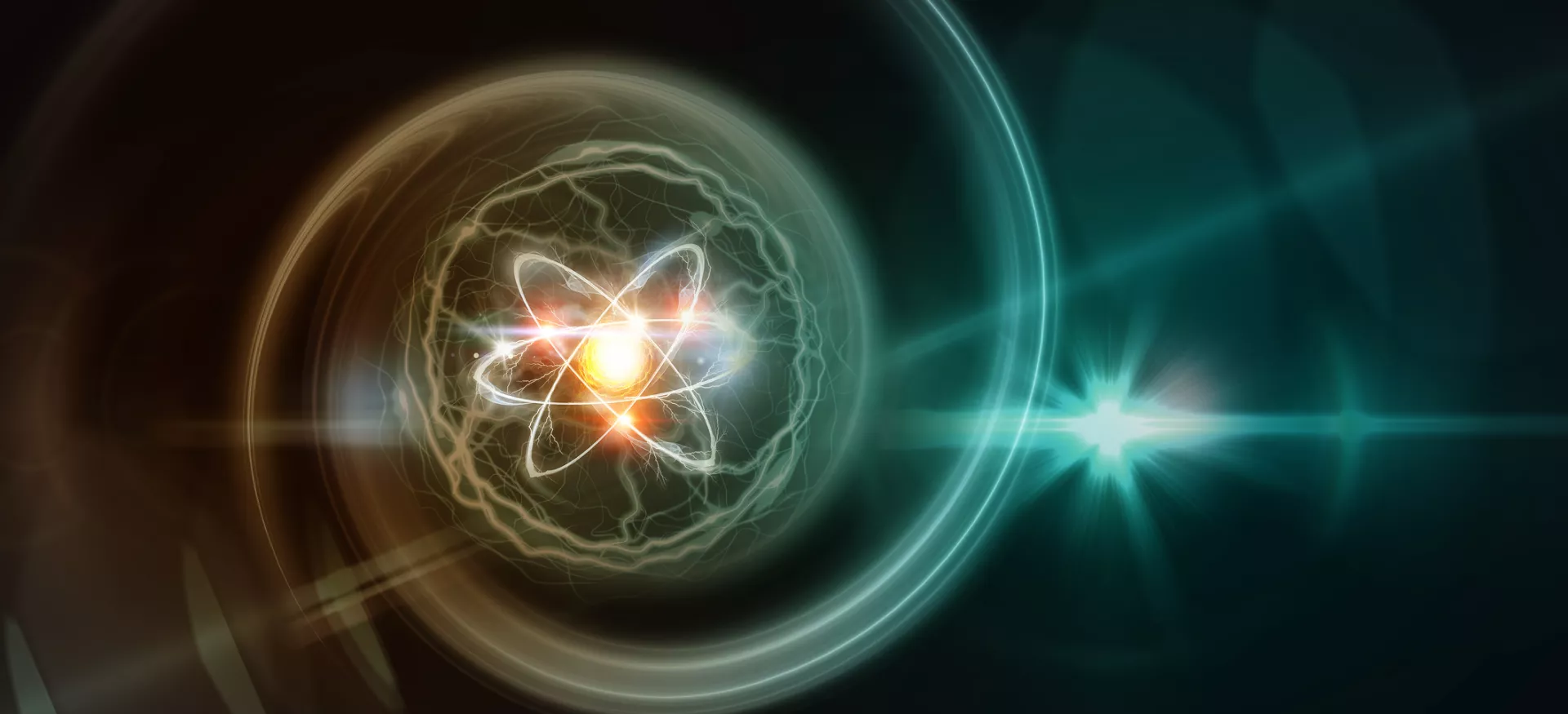 Digital illustration of an atom with glowing electrons orbiting a bright nucleus, surrounded by swirling energy and light flares on a dark background. 