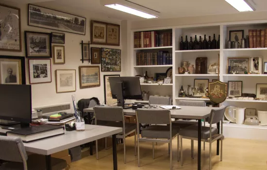 An image of the Trinity College Archive reading room, with ephemera displayed on the walls.