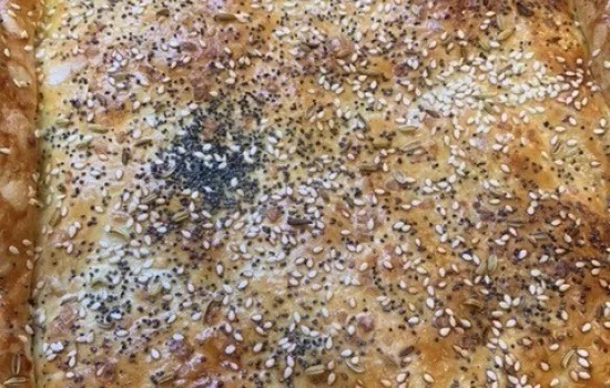 A fish pie with puff pastry and seed crust.