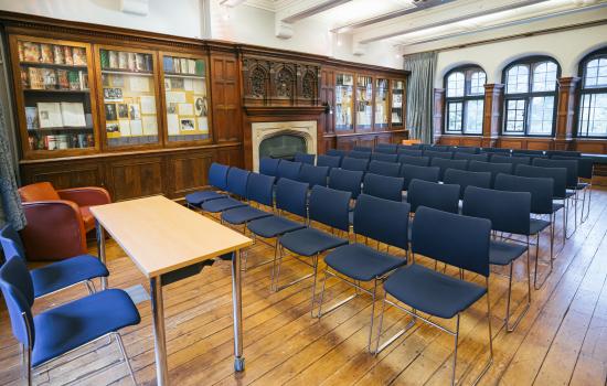 The Trinity College Sutro Room set up in lecture theatre style with chairs.