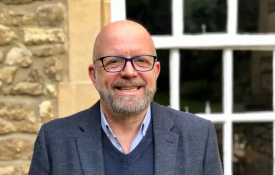 Trinity SCR Steward Jonathan Flint stands smiling.