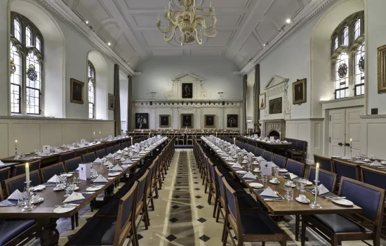 The restored Trinity dining hall set for a formal banquet.