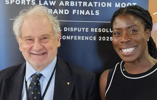 Michael Beloff stands next to British athlete Christine Ohorugu