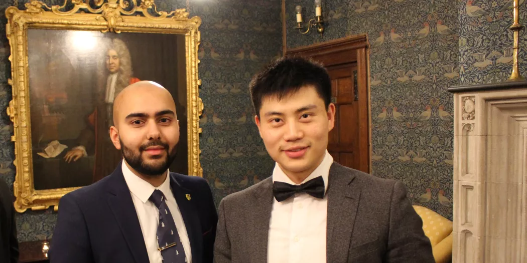 Two Trinity law students pose together at a college Law Society dinner.