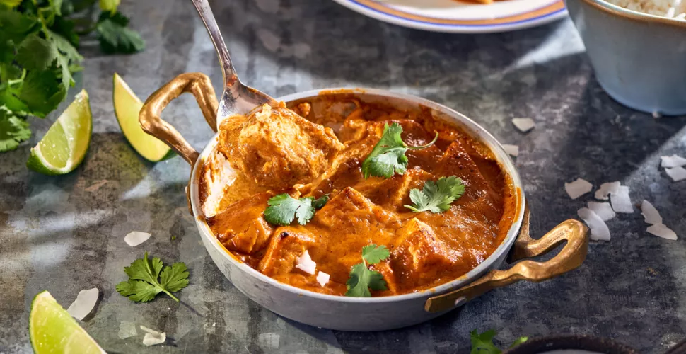 A Madras curry in a metal bowl.