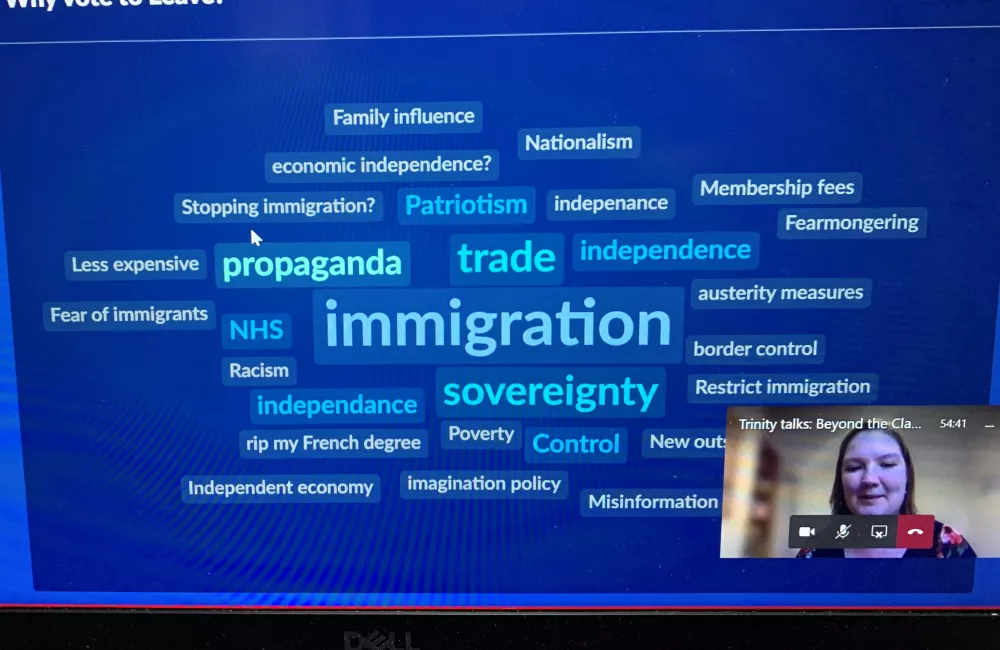 An image of a computer screen with a word cloud on a blue background. In the bottom right corner a student speaker can be seen.