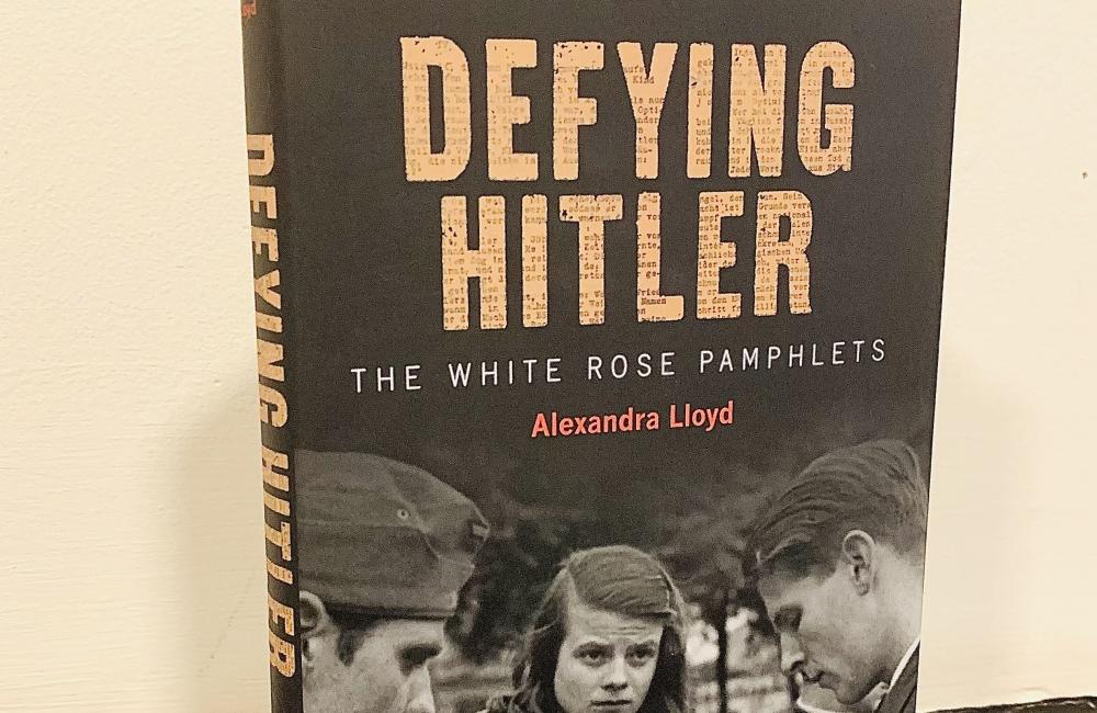 A copy of the book 'Defying Hitler' sits propped up against a wall.