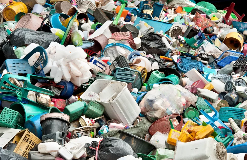 a pile of plastic rubbish at a dump.