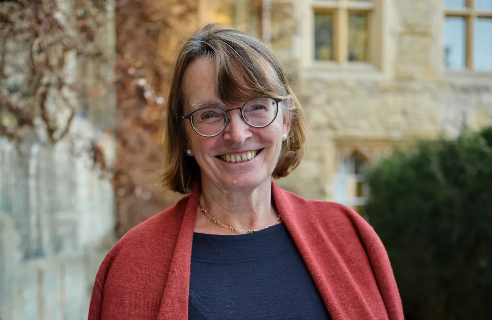 Hilary Boulding stands outside the President's Lodgings at Trinity.