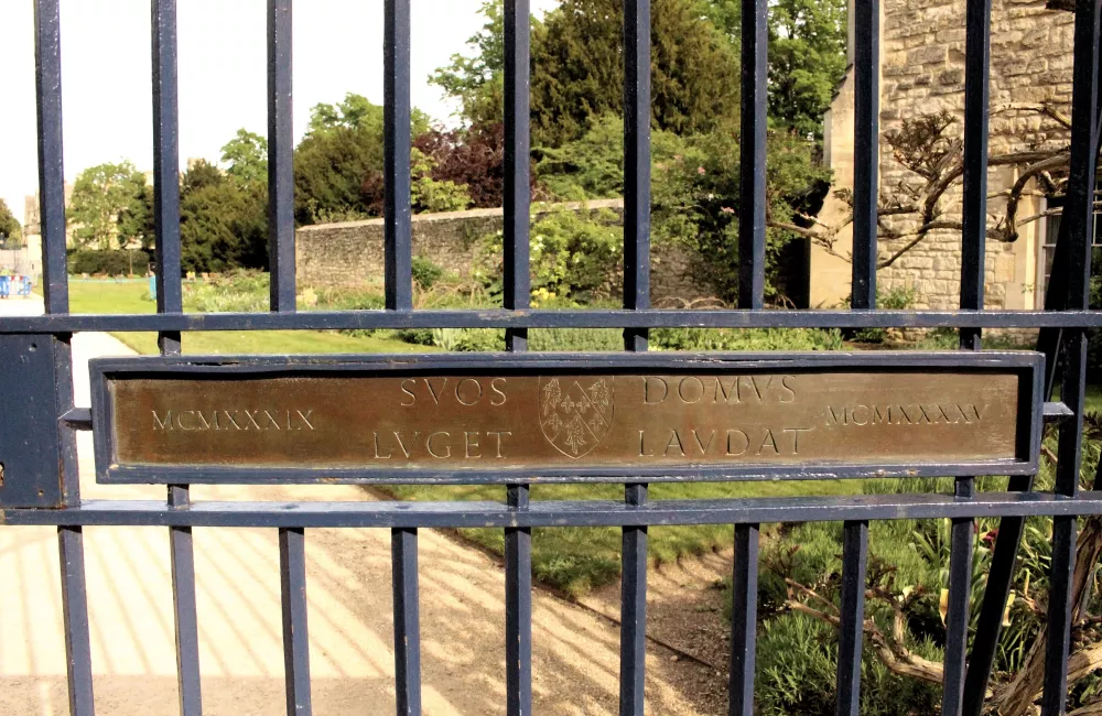 A view onto Trinity's gardens from its War Memorial Gate.