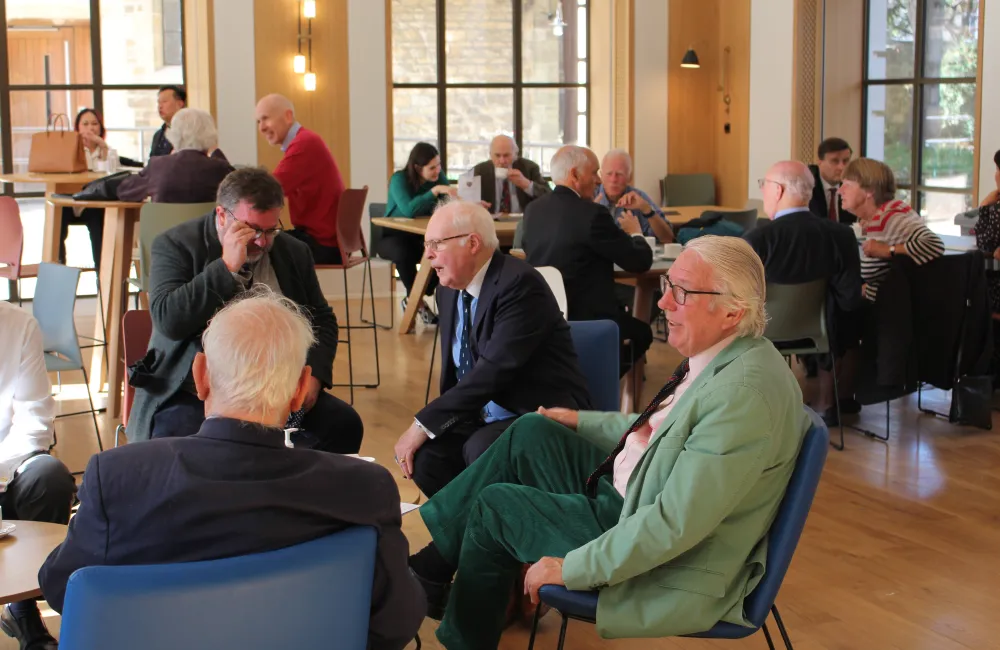 Attendees at the Benefactors lunch enjoy coffee in the Levine Cafe