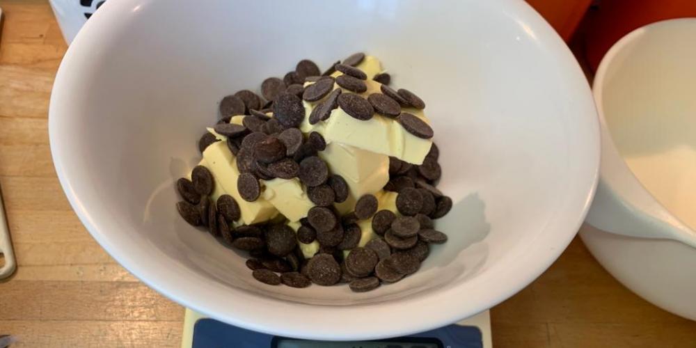 A bowl with butter and chocolate chips.