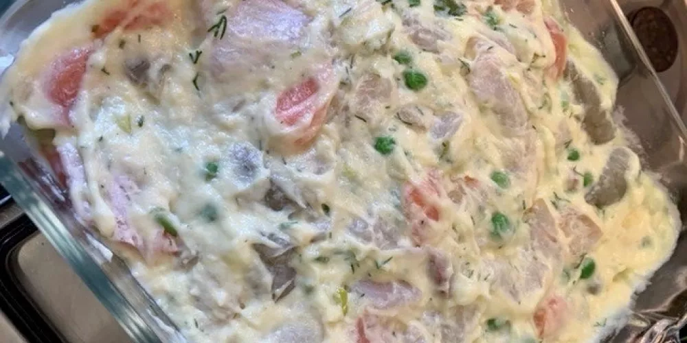 The fish pie in a baking dish assembled.