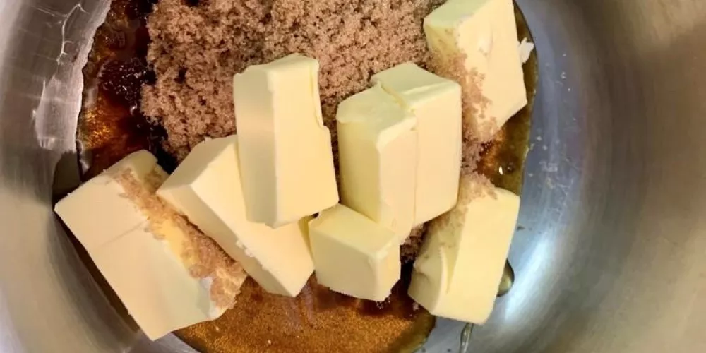 A bowl with butter and sugar ready to be mixed.