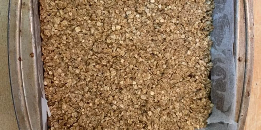 The mixed flapjack in a pan ready to cook.