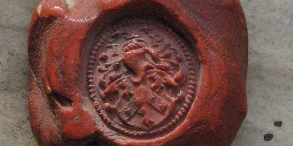 A signet seal in red wax. 