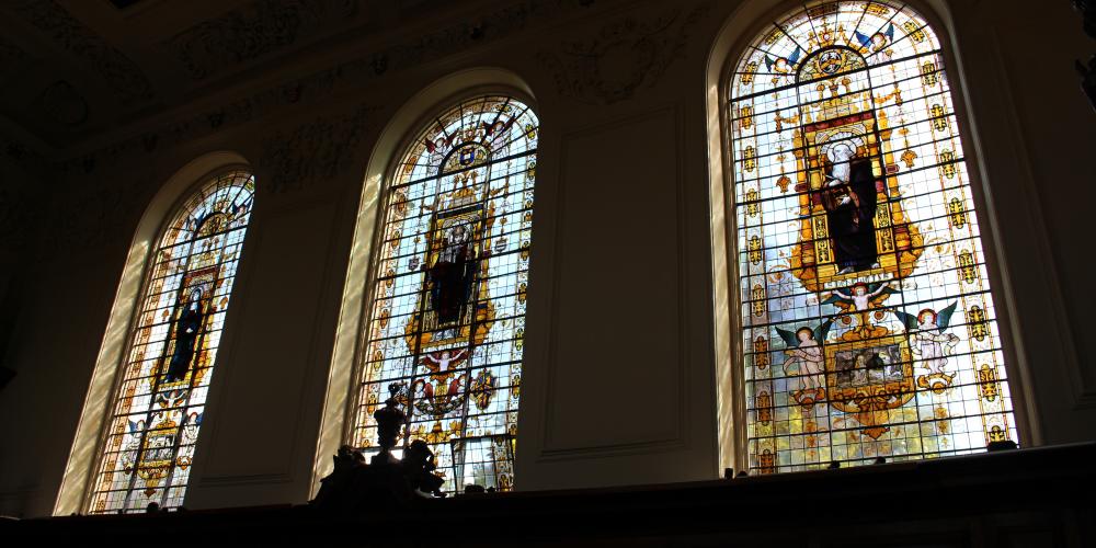 A view of the Trinity College stained glass from the inside