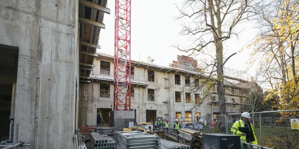 A wide angle shot of the Levine Building as seen from the ground. 