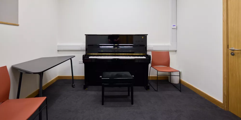 The piano and setup in Music room 3 of the Levine Building.