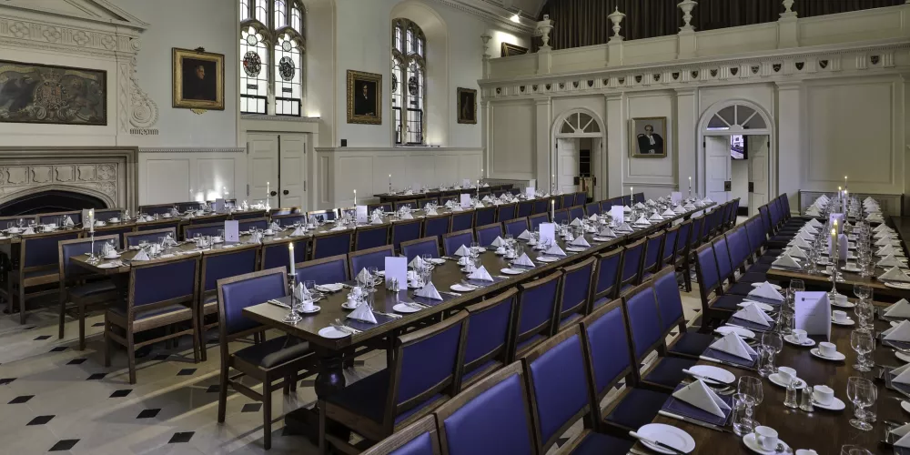 The trinity dining hall set for a formal banquet.