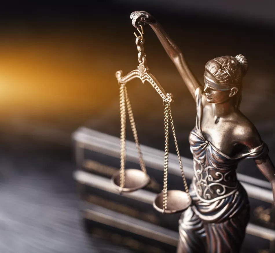 A metal sculpture of Lady Justice.