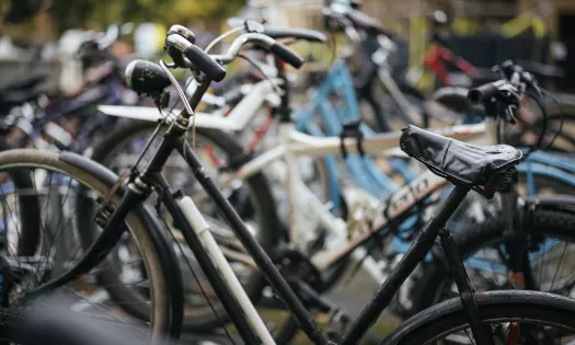 A close-up of bicycles parked in Trinity college.