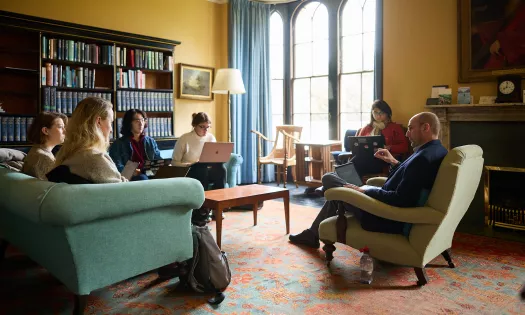 A PPE tutorial with Politics tutor Steve Fisher leading a tutorial in his study.