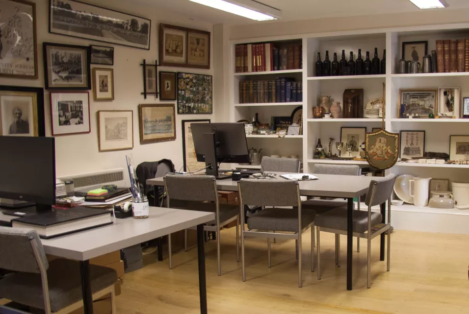 An image of the Trinity College Archive reading room, with ephemera displayed on the walls.