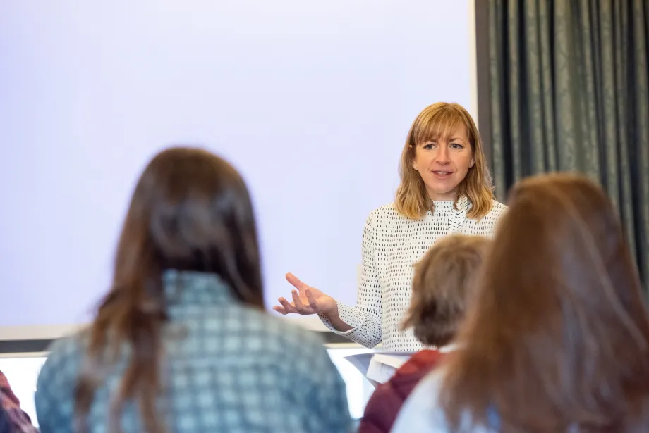 Trinity Head of Access Hannah Rolley gestures during a visit with school students.