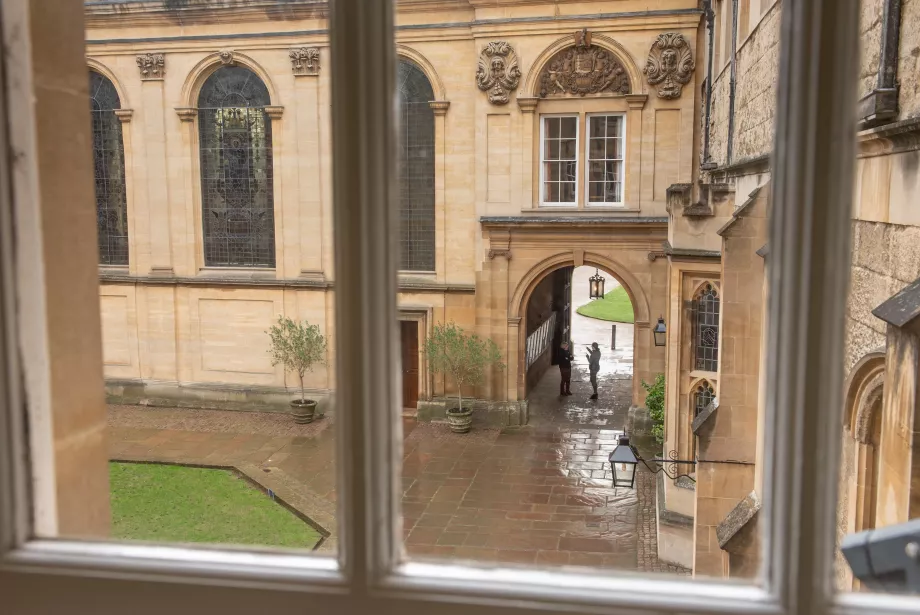A view out of a second-floor window in Trinity College onto the quad below.