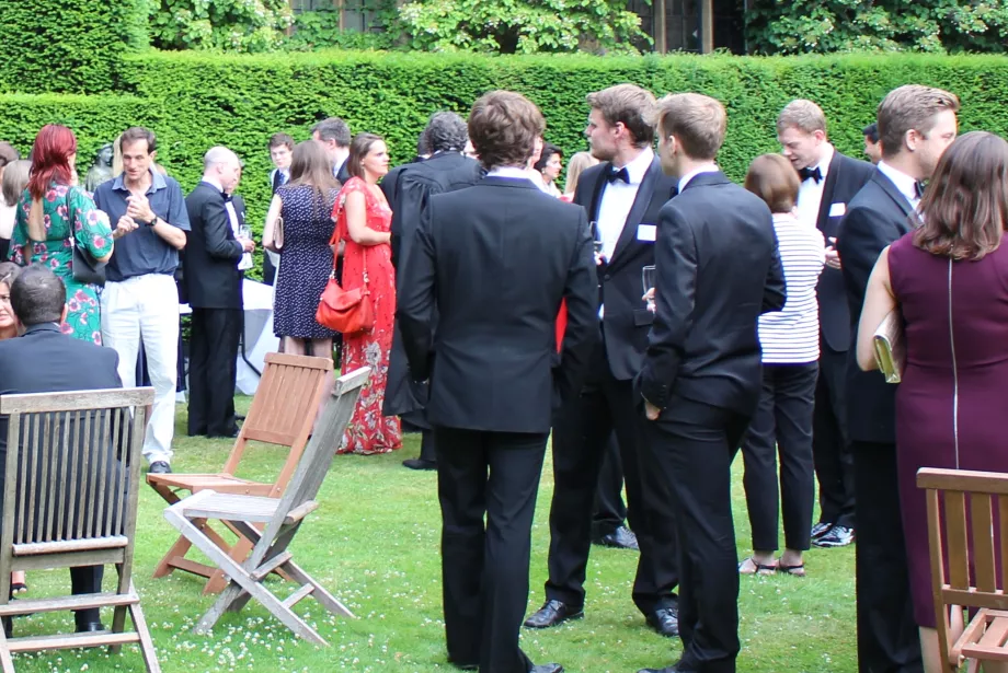 people in black tie in garden setting