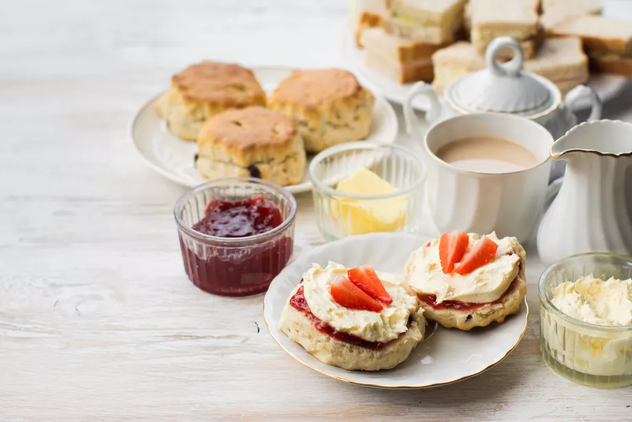 A table set with cream tea and scones.
