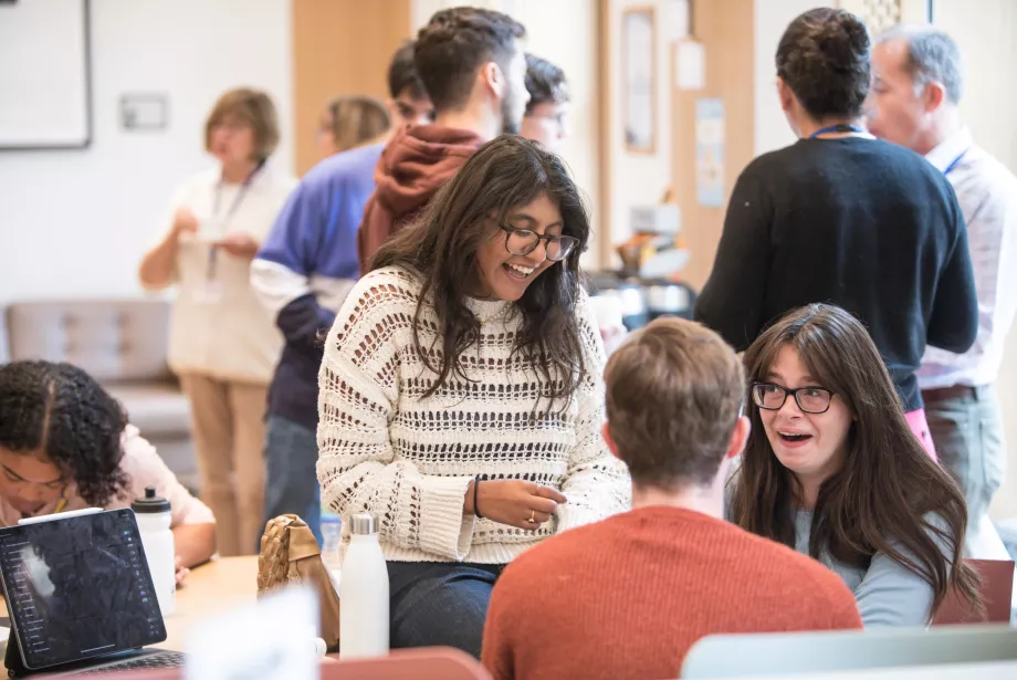 A group of students talk in the Trinity cafe.